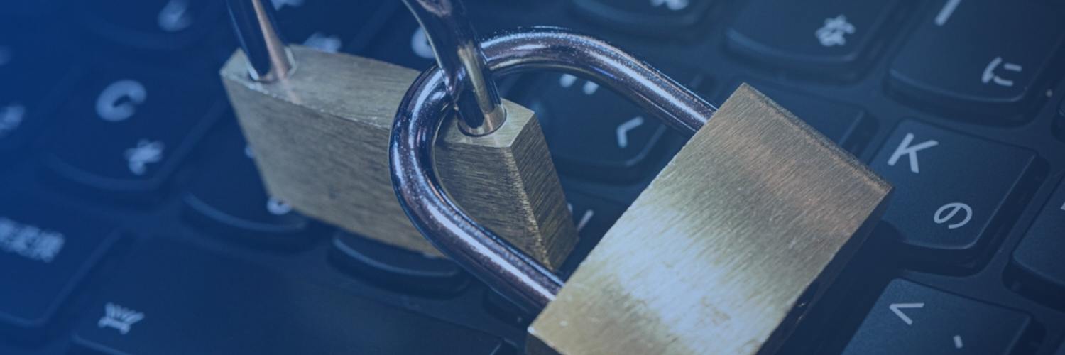 Padlocks resting on a laptop keyboard